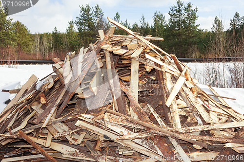 Image of Pile of boards procured as firewood 