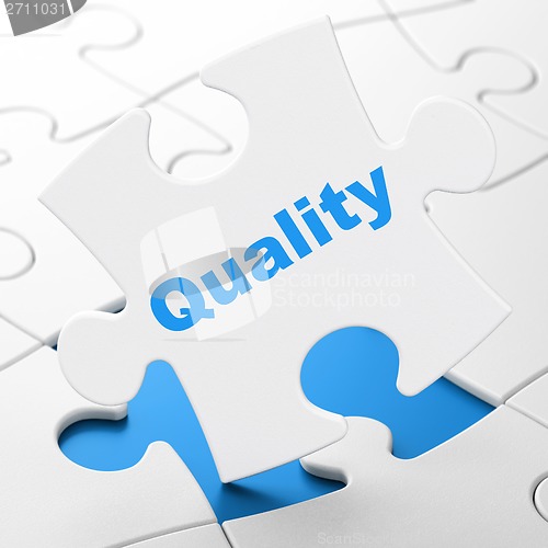 Image of Marketing concept: Quality on puzzle background
