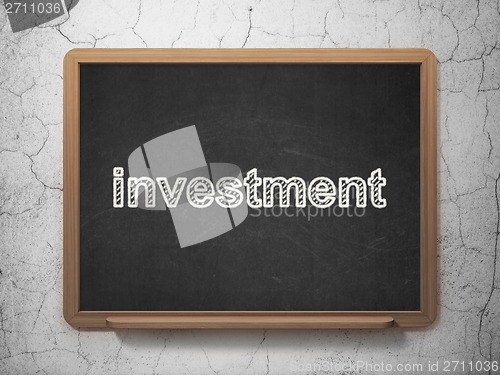 Image of Business concept: Investment on chalkboard background