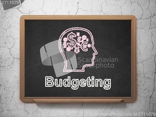 Image of Finance concept: Head With Finance Symbol and Budgeting on chalkboard background