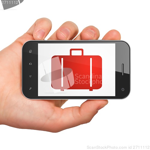 Image of Tourism concept: Bag on smartphone