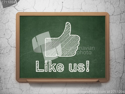 Image of Social media concept: Thumb Up and Like us! on chalkboard background
