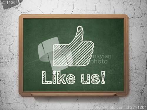 Image of Social media concept: Thumb Up and Like us! on chalkboard background