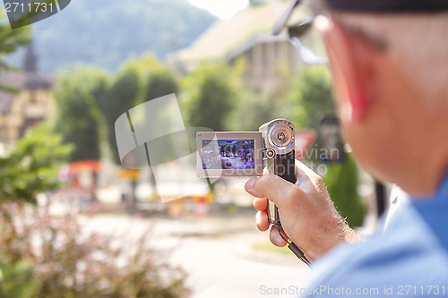 Image of elderly man with video camera