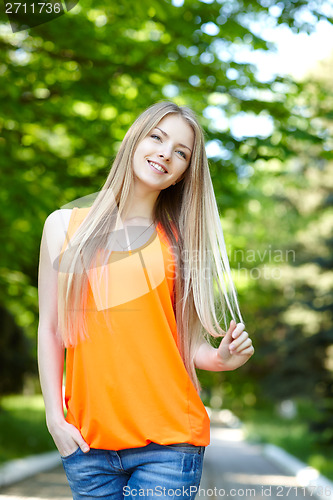 Image of Pretty young woman outdoors.