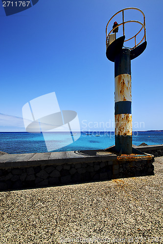 Image of lighthouse and pier  in the lanzarote spain