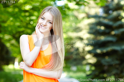 Image of Pretty young woman outdoors.