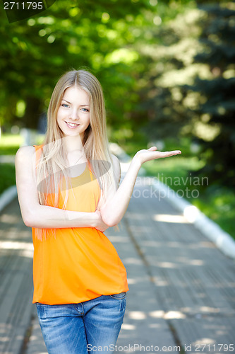 Image of Pretty young woman outdoors.