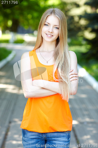 Image of Pretty young woman outdoors.