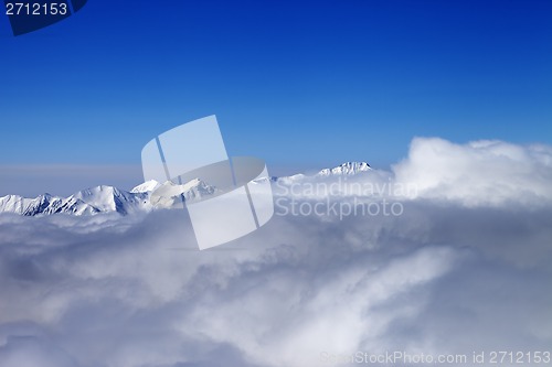 Image of Mountains in clouds at nice sun day
