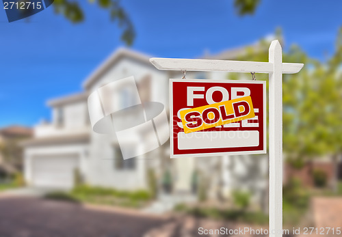 Image of Sold Home For Sale Sign in Front of New House