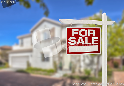 Image of Home For Sale Sign in Front of New House