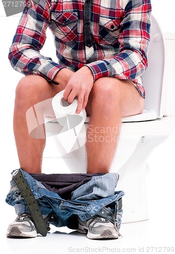 Image of Man on toilet bowl