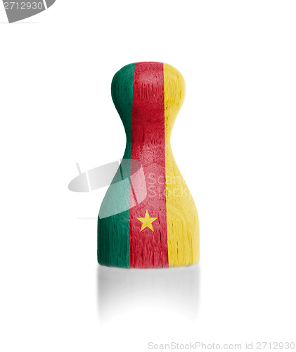 Image of Wooden pawn with a painting of a flag