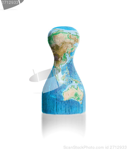 Image of Wooden pawn with a painting of a map