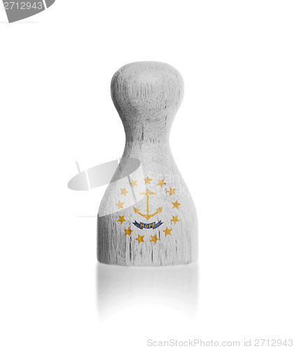 Image of Wooden pawn with a painting of a flag