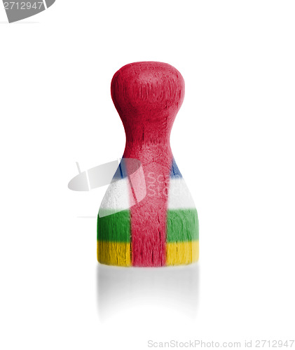 Image of Wooden pawn with a painting of a flag