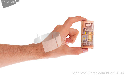 Image of Roll of 50 euro bills in hand