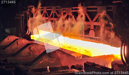 Image of hot steel on conveyor