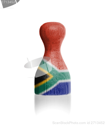 Image of Wooden pawn with a flag painting
