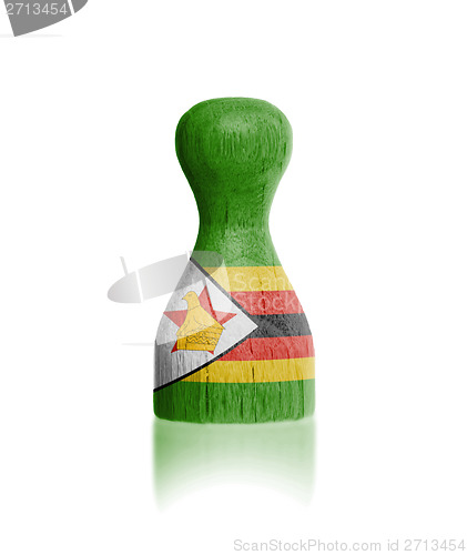 Image of Wooden pawn with a flag painting