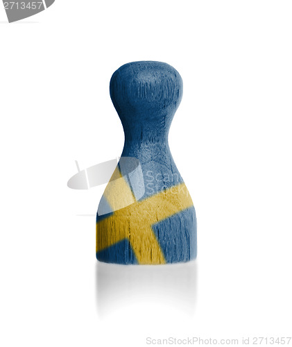 Image of Wooden pawn with a flag painting