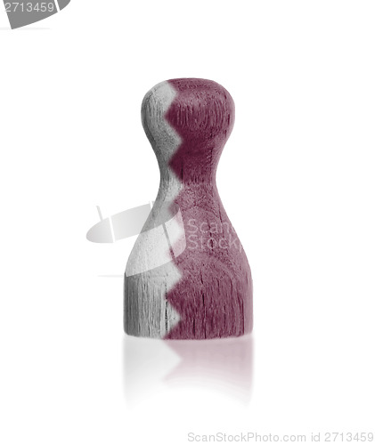 Image of Wooden pawn with a flag painting