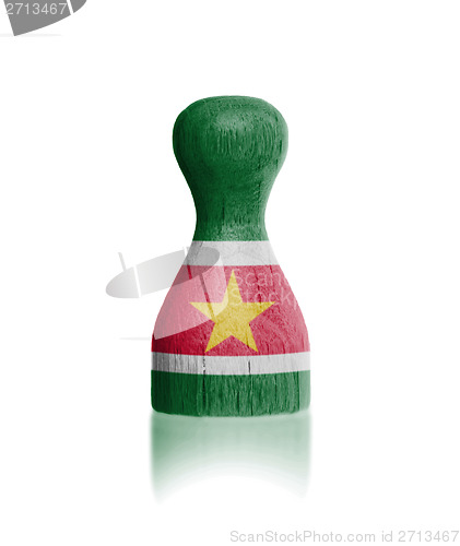 Image of Wooden pawn with a flag painting