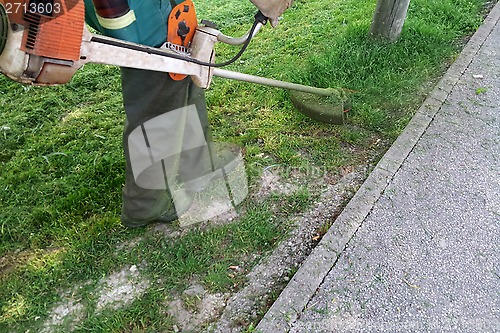 Image of Mowing grass