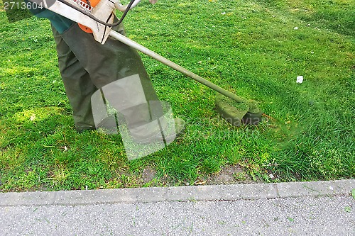 Image of Mowing grass
