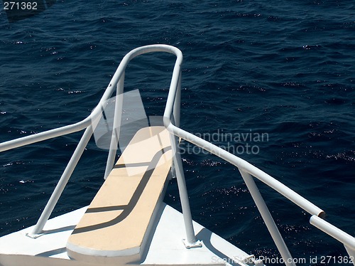 Image of Boat with a white bow and broken railing