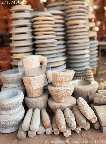 Image of Pile of stone ware for sale. Open Market in Myanmar