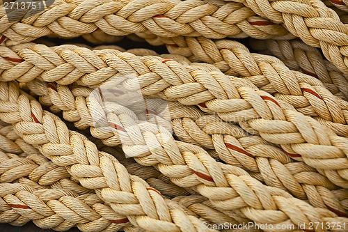 Image of Nautical knots. Big marine vintage sea ropes in heap background