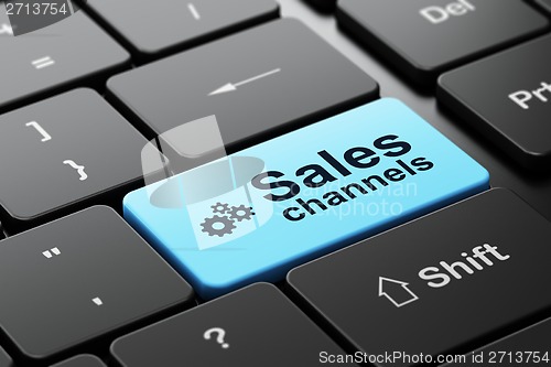 Image of Advertising concept: Gears and Sales Channels on computer keyboard background