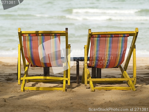 Image of Two chairs on the beach