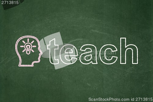 Image of Education concept: Head With Lightbulb and Teach on chalkboard background