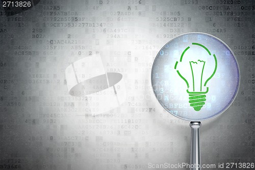 Image of Finance concept:  Light Bulb with optical glass on digital background