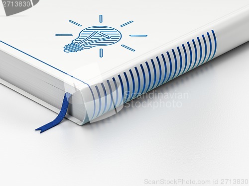Image of Business concept: closed book, Light Bulb on white background