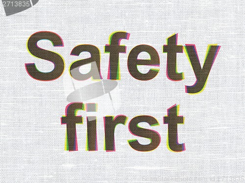 Image of Protection concept: Safety First on fabric texture background