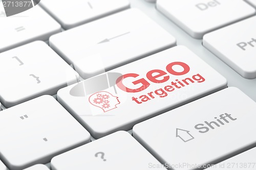 Image of Business concept: Head With Gears and Geo Targeting on computer keyboard background