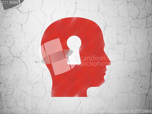 Image of Finance concept: Head With Keyhole on wall background