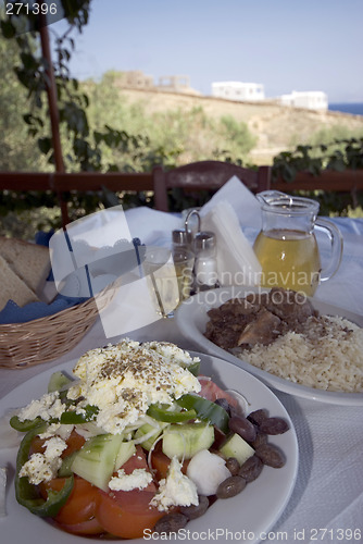 Image of greek taverna lunch over sea view