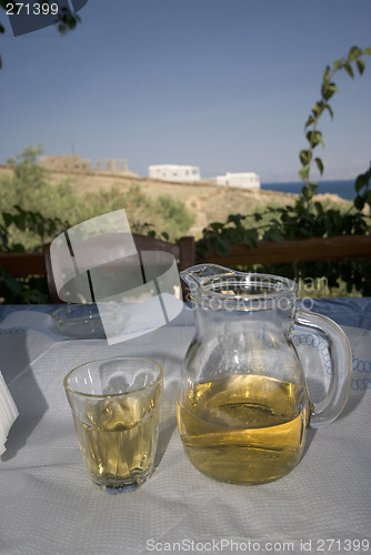 Image of wine on table greek island view