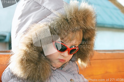 Image of Portrait of cute little girl in winter season