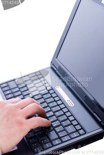 Image of Male hand typing on laptop