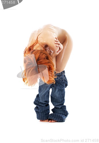 Image of naked redhead in blue jeans over white