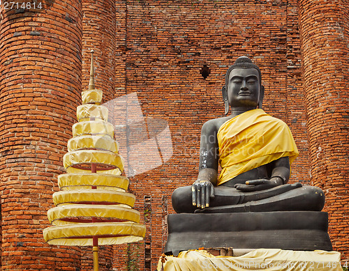 Image of Buddha statue in ruins of the temple. Ayuthaya, Thailand