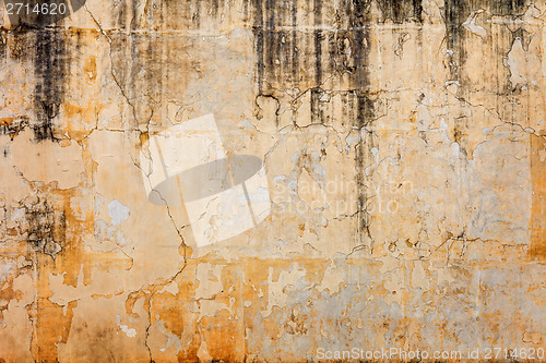 Image of Old concrete wall with peels off paint