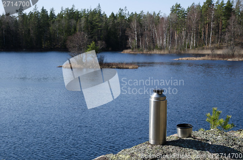 Image of Thermos by forest lake side