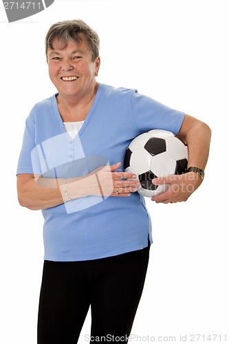 Image of Senior woman with soccer ball